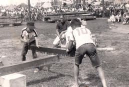 Junior crosscut competition at early Tupper Lake Woodsmen's Days event